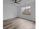 Bright bedroom with hardwood flooring, ceiling fan and large window at 5680 Gold Creek Bay None, Hickory, NC 28601