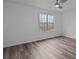 Bright bedroom with hardwood flooring, and a large window at 5680 Gold Creek Bay None, Hickory, NC 28601