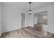 Open-concept dining room with wood-look floors and access to multiple rooms at 5680 Gold Creek Bay None, Hickory, NC 28601