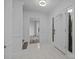 A bright foyer with white tile flooring and a view into an adjacent room at 5680 Gold Creek Bay None, Hickory, NC 28601
