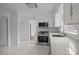 Bright white kitchen with stainless steel appliances and a modern black range at 5680 Gold Creek Bay None, Hickory, NC 28601