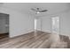 Spacious main bedroom with ceiling fan, hardwood floors, and ensuite bathroom access at 5680 Gold Creek Bay None, Hickory, NC 28601