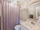 Bathroom featuring a chandelier, framed mirror, and a shower with a curtain at 6225 Woodleigh Oaks Dr, Charlotte, NC 28226