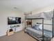 Bedroom with a bunk bed, TV, and comfortable furnishings at 6225 Woodleigh Oaks Dr, Charlotte, NC 28226
