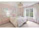 Charming bedroom with canopy bed, swing chair, and natural light from the window at 6225 Woodleigh Oaks Dr, Charlotte, NC 28226