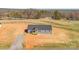 Expansive view of new construction home with gray siding, dark roof, and a covered front porch, set on a spacious lot at 629 Mt. Wesley Church Rd, Hiddenite, NC 28636