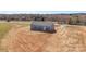 An aerial view showcases the home's new gray siding, dark roof, back entrance and spacious lot ready for landscaping at 629 Mt. Wesley Church Rd, Hiddenite, NC 28636