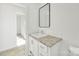 Bright bathroom featuring modern vanity, framed mirror, and neutral finishes, exuding a clean and comfortable atmosphere at 629 Mt. Wesley Church Rd, Hiddenite, NC 28636
