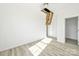 Bright bedroom with neutral walls, simple flooring and attic entrance at 629 Mt. Wesley Church Rd, Hiddenite, NC 28636