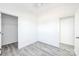 Bright bedroom with neutral walls, simple flooring and closet space at 629 Mt. Wesley Church Rd, Hiddenite, NC 28636