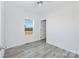 Minimalist bedroom showcasing a window for natural light and neutral flooring at 629 Mt. Wesley Church Rd, Hiddenite, NC 28636
