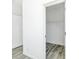 Walk-in closet with gray flooring, white walls, and wire shelving at 629 Mt. Wesley Church Rd, Hiddenite, NC 28636