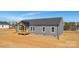 Charming home featuring gray siding, dark roof, a covered front porch, and pristine lot at 629 Mt. Wesley Church Rd, Hiddenite, NC 28636