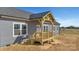 New construction home with gray siding, a dark gray roof, and a charming, covered, wood-framed front porch at 629 Mt. Wesley Church Rd, Hiddenite, NC 28636