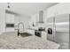 Close up shot of kitchen island with granite countertop, stainless steel appliances and modern faucet at 629 Mt. Wesley Church Rd, Hiddenite, NC 28636