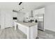 Beautiful kitchen island and stainless appliances, featuring wood-look floors and recessed lighting at 629 Mt. Wesley Church Rd, Hiddenite, NC 28636