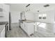 Open concept kitchen with a center island, stainless steel appliances and gray floors at 629 Mt. Wesley Church Rd, Hiddenite, NC 28636
