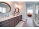 Primary bathroom with double vanity, granite countertops, and a glass-enclosed shower at 630 Deese Rd, Monroe, NC 28110