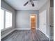 Open bedroom showing the door leading to a bathroom with natural light from the window at 630 Deese Rd, Monroe, NC 28110