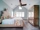 Spacious bedroom with vaulted ceilings, plush headboard, and mirrored armoire at 630 Deese Rd, Monroe, NC 28110