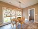 Charming dining area with a decorative light fixture, and many windows allowing for natural light at 630 Deese Rd, Monroe, NC 28110