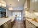 Well-lit kitchen featuring an island, stainless steel appliances, and an adjacent dining area at 630 Deese Rd, Monroe, NC 28110