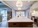 Modern kitchen with a large island, stainless steel appliances and a bright eat-in kitchen area at 630 Deese Rd, Monroe, NC 28110