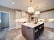 Bright kitchen island with seating, stainless appliances, and ample cabinet space at 630 Deese Rd, Monroe, NC 28110