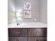 Laundry room with a white countertop, dark cabinets, and artwork on the walls at 630 Deese Rd, Monroe, NC 28110