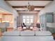 Bright living room with high ceilings, wood beams, and a seamless connection to other living spaces at 630 Deese Rd, Monroe, NC 28110