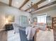 Cozy living room with wood beams, stylish furnishings, and a statement cabinet at 630 Deese Rd, Monroe, NC 28110
