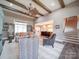 Bright, open living room featuring vaulted ceiling, wood beams, and seamless flow to the kitchen at 630 Deese Rd, Monroe, NC 28110