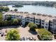 Lakeside condo community with manicured landscaping and ample parking at 637 Williamson Rd # 304, Mooresville, NC 28117