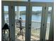 Outdoor balcony includes a bar-height table and chairs with a lake view at 637 Williamson Rd # 304, Mooresville, NC 28117