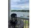 Water view from balcony with boats docked along shoreline and lake view at 637 Williamson Rd # 304, Mooresville, NC 28117