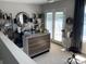 Stylish bar area with lake view, ample shelving, and a unique wooden-framed mirror at 637 Williamson Rd # 304, Mooresville, NC 28117