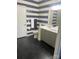 Coastal-themed bathroom features a vanity with storage and a well-lit mirror with a tile floor at 637 Williamson Rd # 304, Mooresville, NC 28117