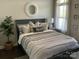 Comfortable bedroom with stylish bed frame, neutral colors, and plenty of natural light at 637 Williamson Rd # 304, Mooresville, NC 28117