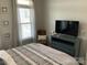 Comfortable bedroom with stylish bed frame, neutral colors, and plenty of natural light at 637 Williamson Rd # 304, Mooresville, NC 28117
