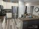 Well-equipped kitchen with stainless steel appliances and granite countertops at 637 Williamson Rd # 304, Mooresville, NC 28117