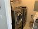 Functional laundry room equipped with modern washer and dryer units and ample storage space at 637 Williamson Rd # 304, Mooresville, NC 28117
