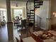 Open living space featuring spiral staircase and dining area at 637 Williamson Rd # 304, Mooresville, NC 28117