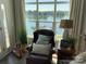 Bright living room with large windows offering stunning lake views and comfortable seating at 637 Williamson Rd # 304, Mooresville, NC 28117