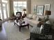 Comfortable living room with ample seating, natural light, and lake views at 637 Williamson Rd # 304, Mooresville, NC 28117