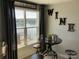 Cozy wine nook with lake views, playful wall decor, and intimate seating arrangement at 637 Williamson Rd # 304, Mooresville, NC 28117
