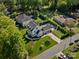 Aerial view showcasing a beautiful home, lush landscaping, and neighborhood at 6700 Folger Dr, Charlotte, NC 28270