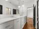Bathroom with a large vanity and sink, a large mirror, and a door to the shower room at 6700 Folger Dr, Charlotte, NC 28270