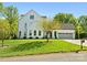 Stately home with mature trees, well-kept lawn, and a two-car garage at 6700 Folger Dr, Charlotte, NC 28270