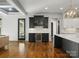 Bright kitchen with dark cabinetry, wine cooler, and marble backsplash, perfect for entertaining at 6700 Folger Dr, Charlotte, NC 28270