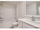 Clean bathroom with a tub-shower combination, a modern vanity, and a large mirror at 7009 New Town Rd, Waxhaw, NC 28173
